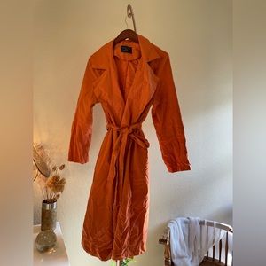 Oversized orange trench coat
